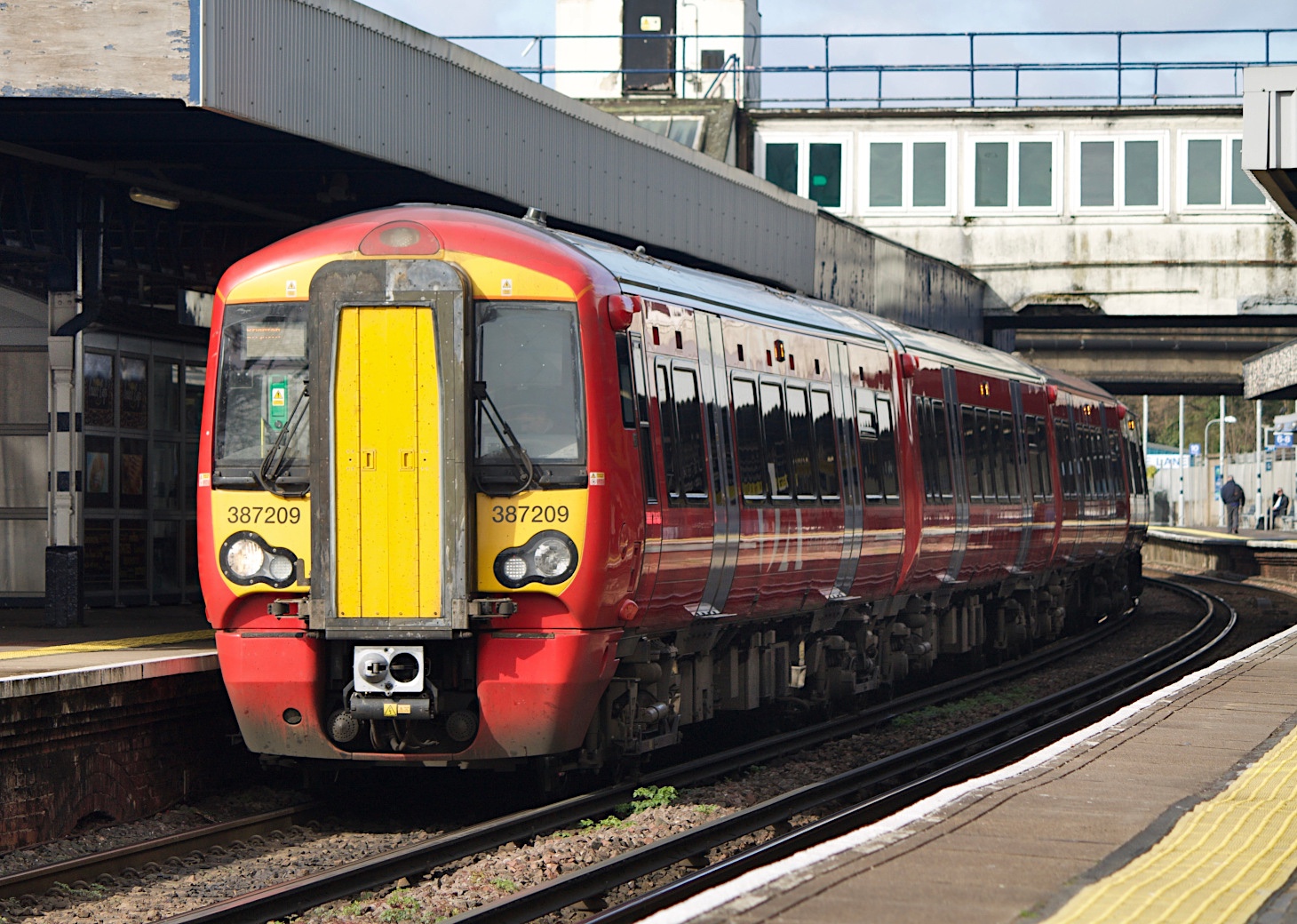 387209